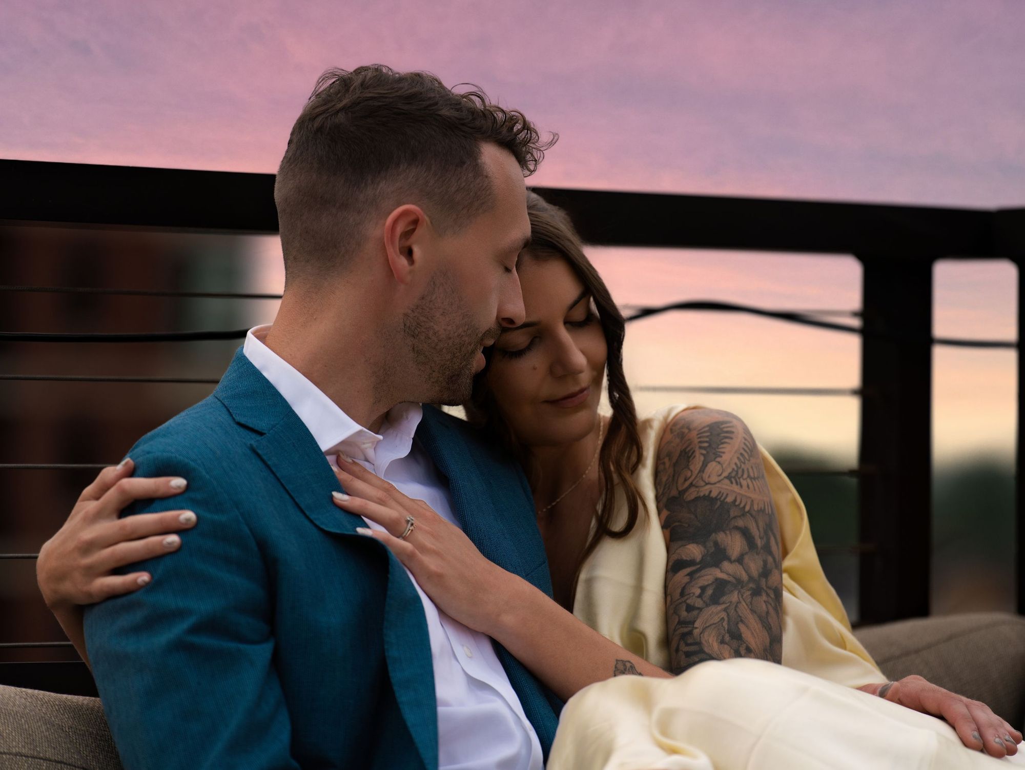 Couple embracing at sunset on a rooftop