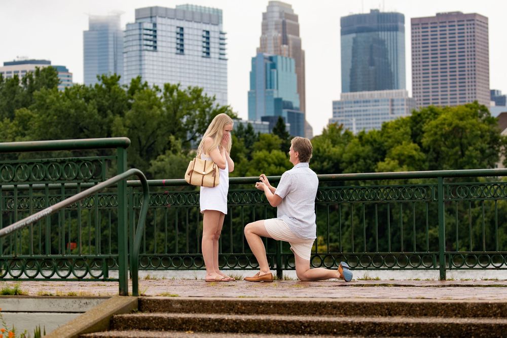 Proposal at a riverside overlook with the skyline