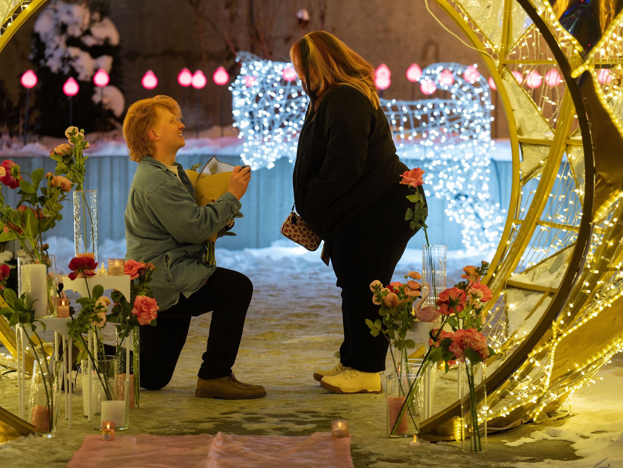 A proposal among glowing winter light displays