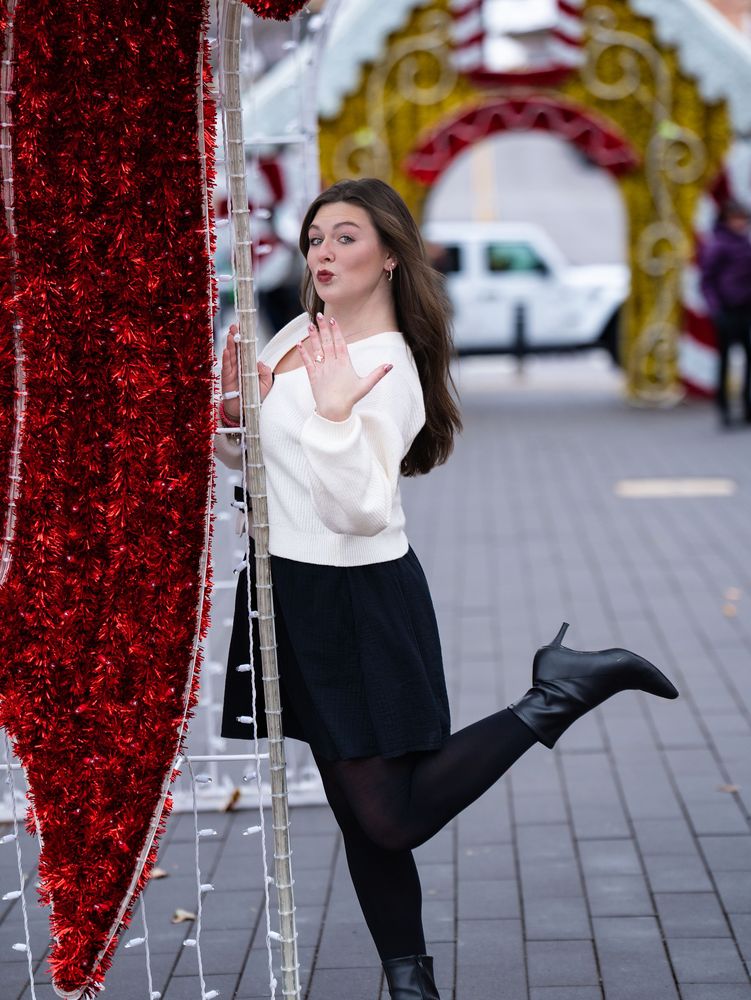 She reacts with joy under holiday lights